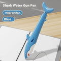 Shark plastic water spray ballpoint pen in blue on white background