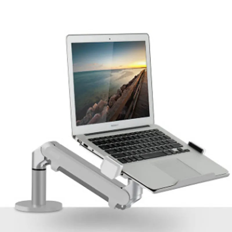 Silver aluminium alloy hover notebook stand on a desk holding a laptop.