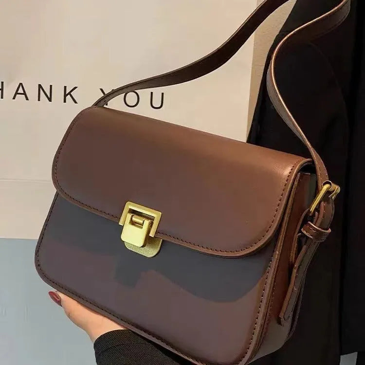 Soft PU leather women's cross-body bag with textured finish in horizontal square silhouette