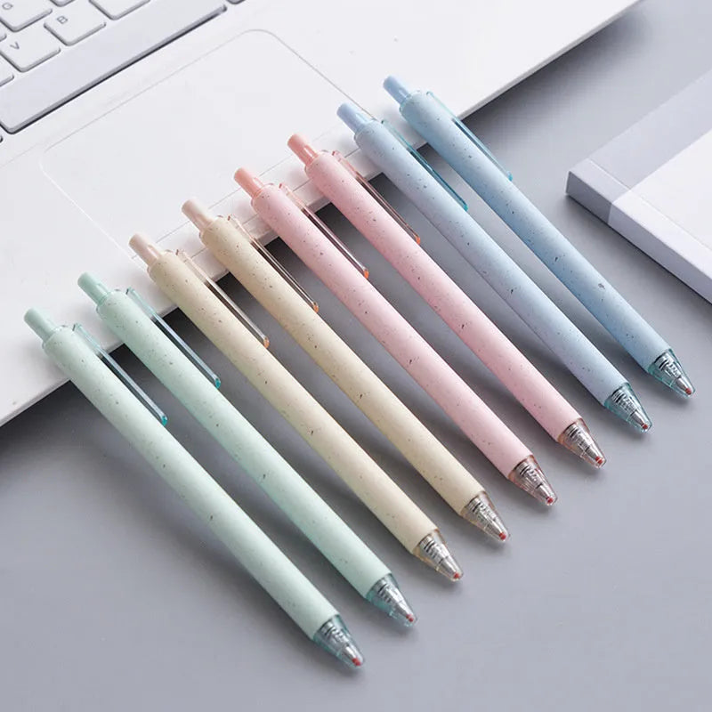Set of twelve 0.5mm push-type gel pens in beige, blue, green, and pink barrels with black ink.