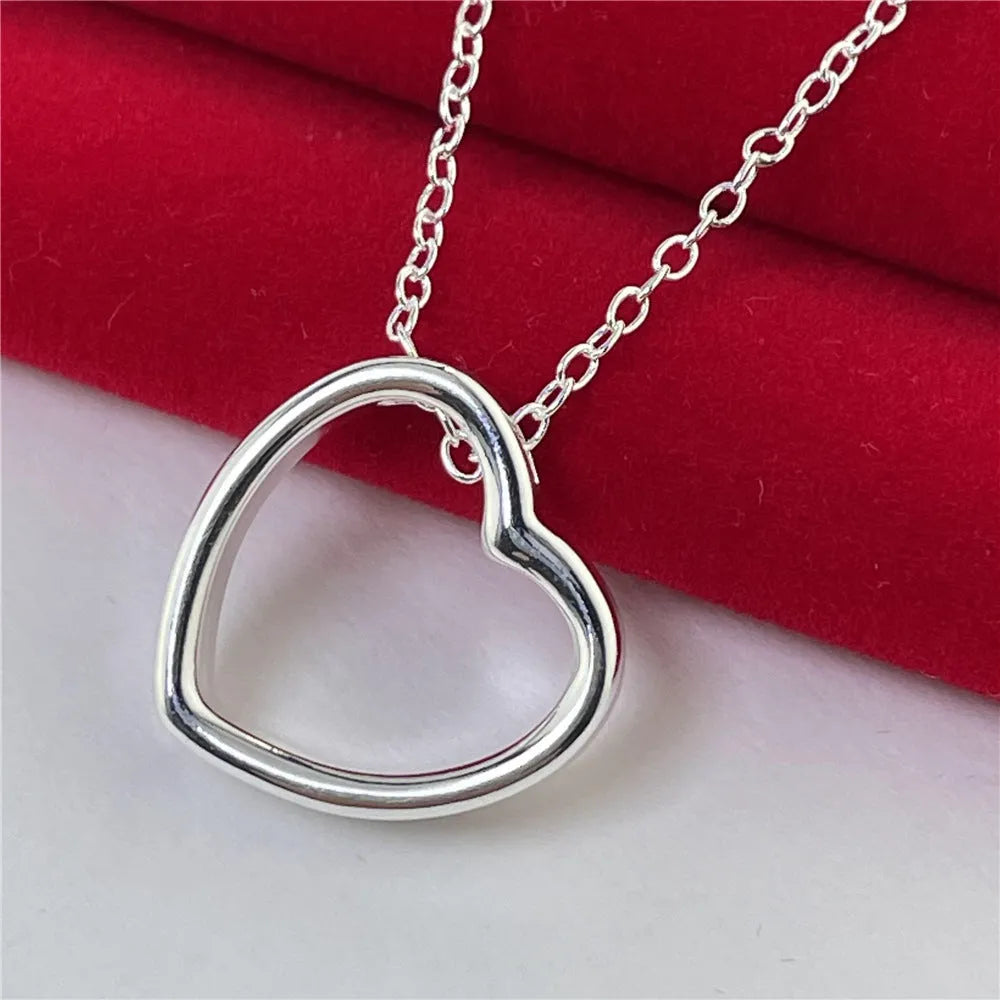 Silver heart necklace for women with 45.5cm chain and 2.6 x 2.8cm heart pendant in thick silver plating over copper.