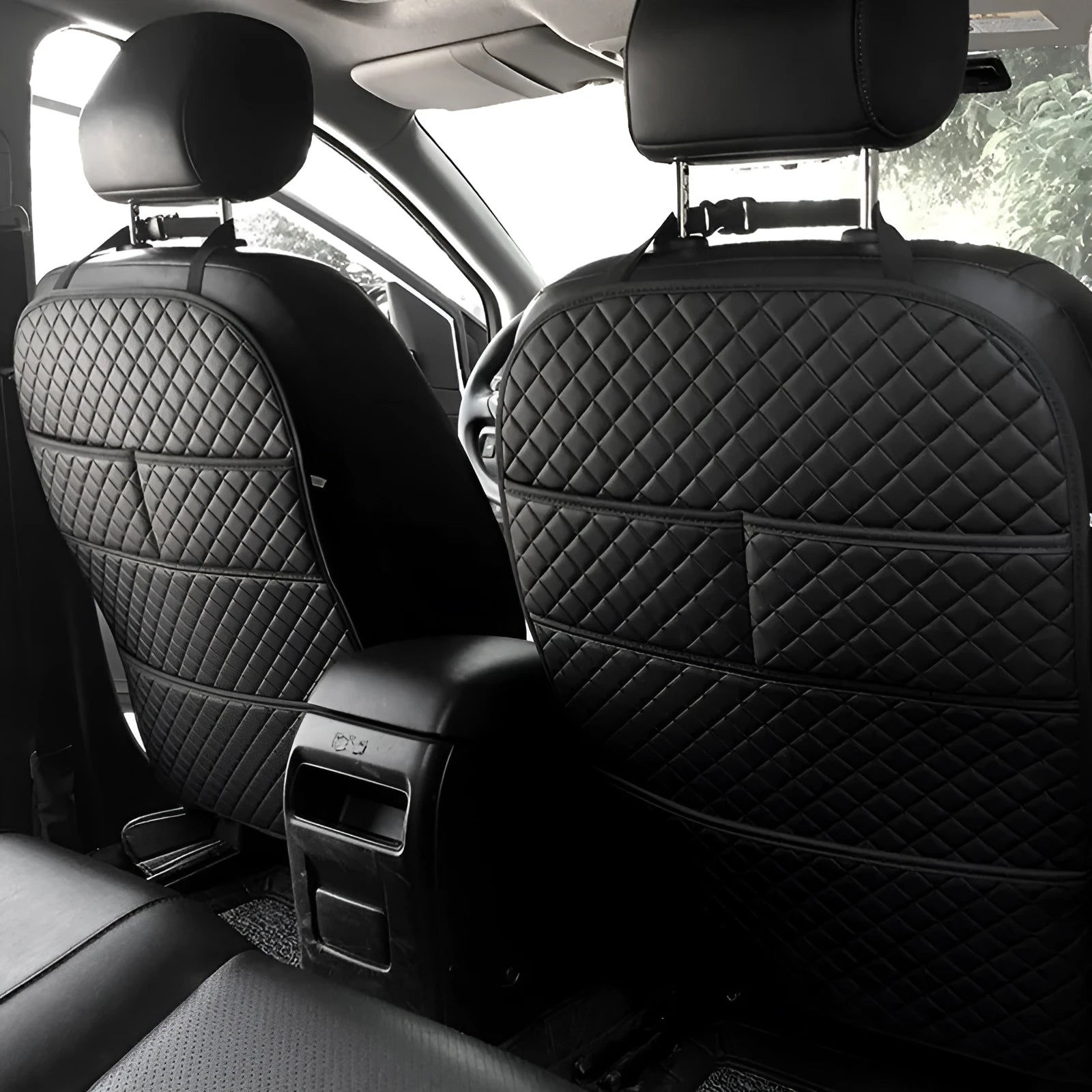 Leather seat anti-kick pad storage bag in black, protecting car seat back from kids' feet.