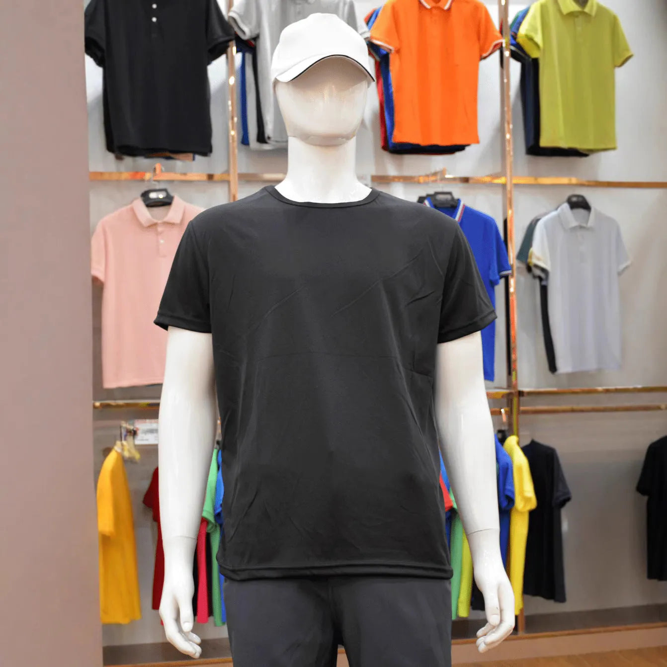 Man wearing a slim fit quick-dry short sleeve T-shirt in a solid colour.