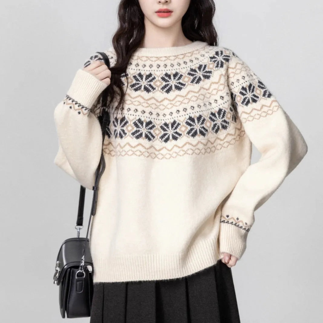 Women's loose-fit Milky White Fair Isle knitted pullover sweater on a hanger, showing geometric pattern and thick lambswool blend fabric.