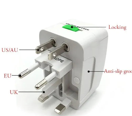 Universal travel plug adapter showing UK, US, EU, and AU pins with dimensions 73x50x39 mm.