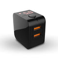 Compact black dual USB travel charger with a digital voltage display showing 5.0V, next to a UK plug.