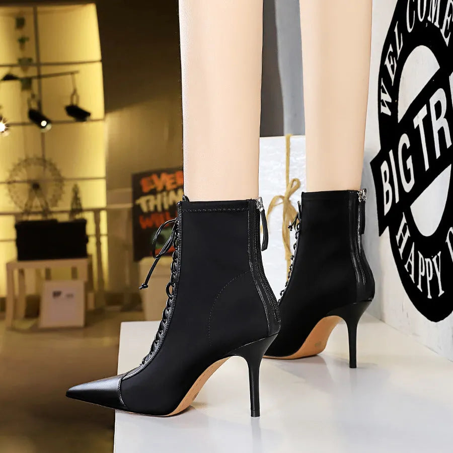 Black women's stiletto heel boots with pointed toe, back zipper, and 6-8CM heel
