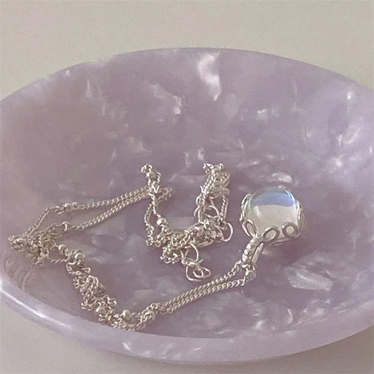 925 silver ornamental stone necklace with round geometric pendant on a curb chain.
