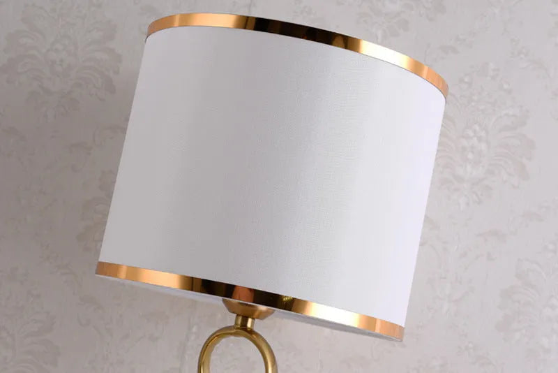 Creative bedside lamp with electroplating imitation copper finish, white colour, on a bedside table with button switch and UK plug