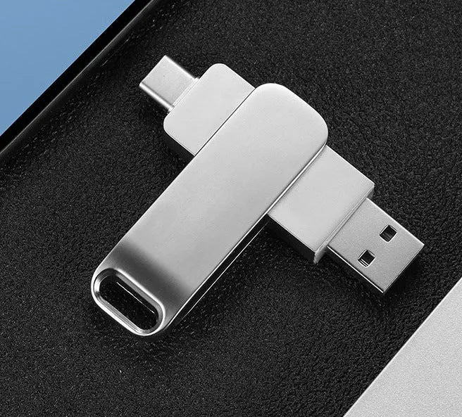 Rotating metal USB flash drive in black showing both USB connector and Type-C interface