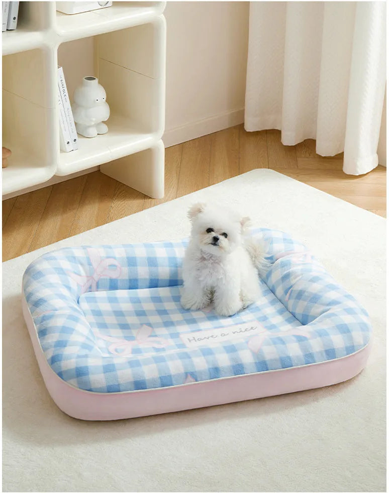 Blue small dog bed cushion with PP cotton fill, size M, on a sofa