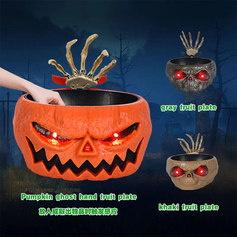 Plastic Halloween pumpkin candy bowl with motion-activated skeleton hand and lighted red eyes