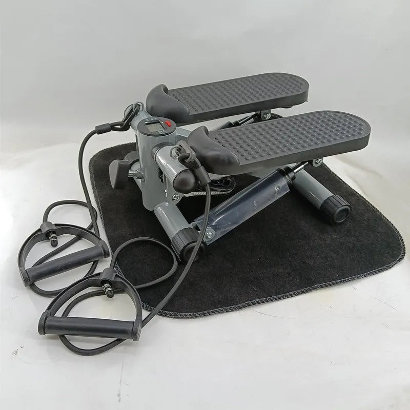 Silver grey hydraulic resistance mini treadmill pedal exerciser for home waist slimming.