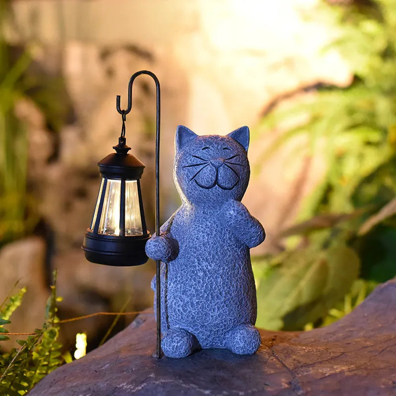 Resin cat lift solar garden lamp with pastoral design and integrated solar panel