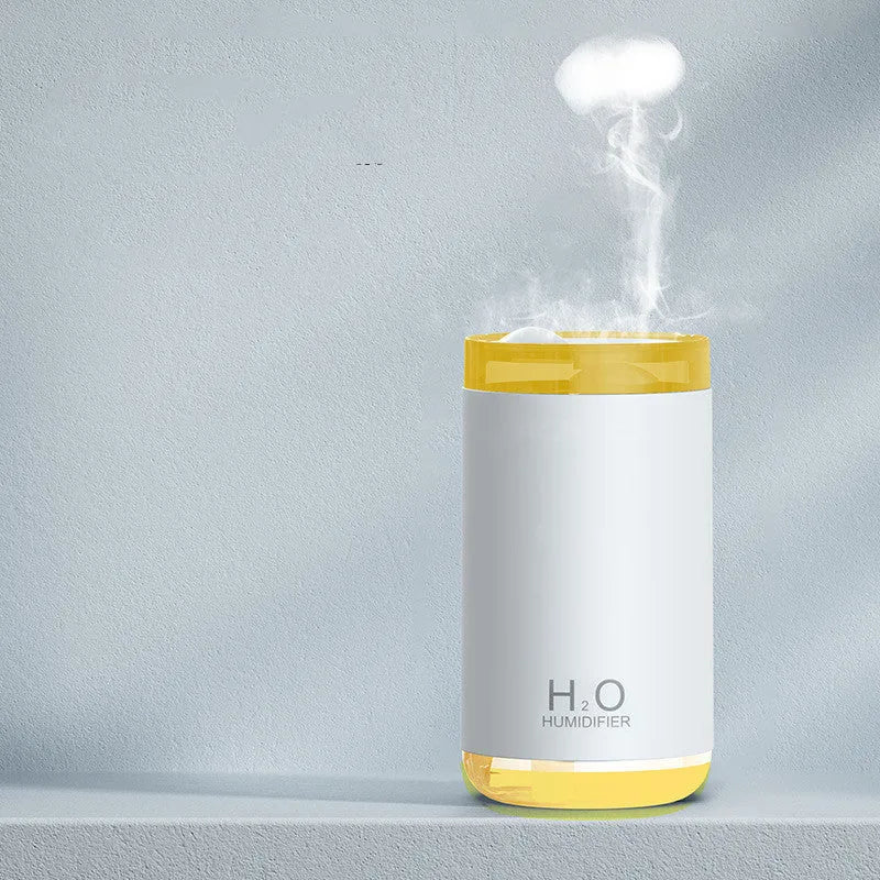 Jellyfish-shaped USB humidifier with smoke ring mist output and warm night light in blue colour