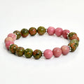 Natural unakite stone 108 prayer beads mala necklace and matching bracelet on neutral background
