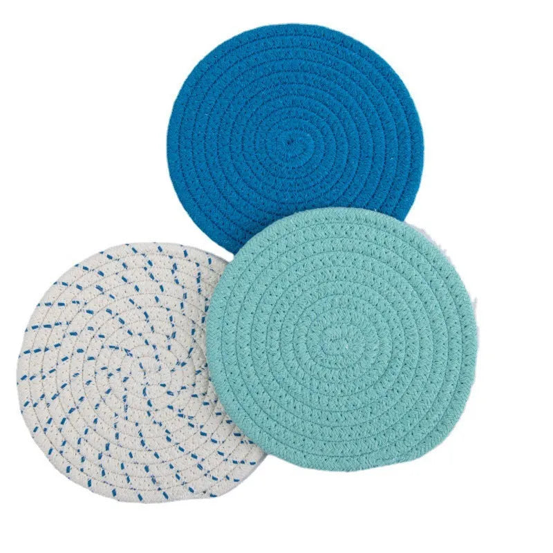 Three round cotton cord coasters in blue colour with modern simplicity design