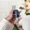 Zinc alloy twist design watch strap with diamond accents for Apple Watch, shown in silver colour.