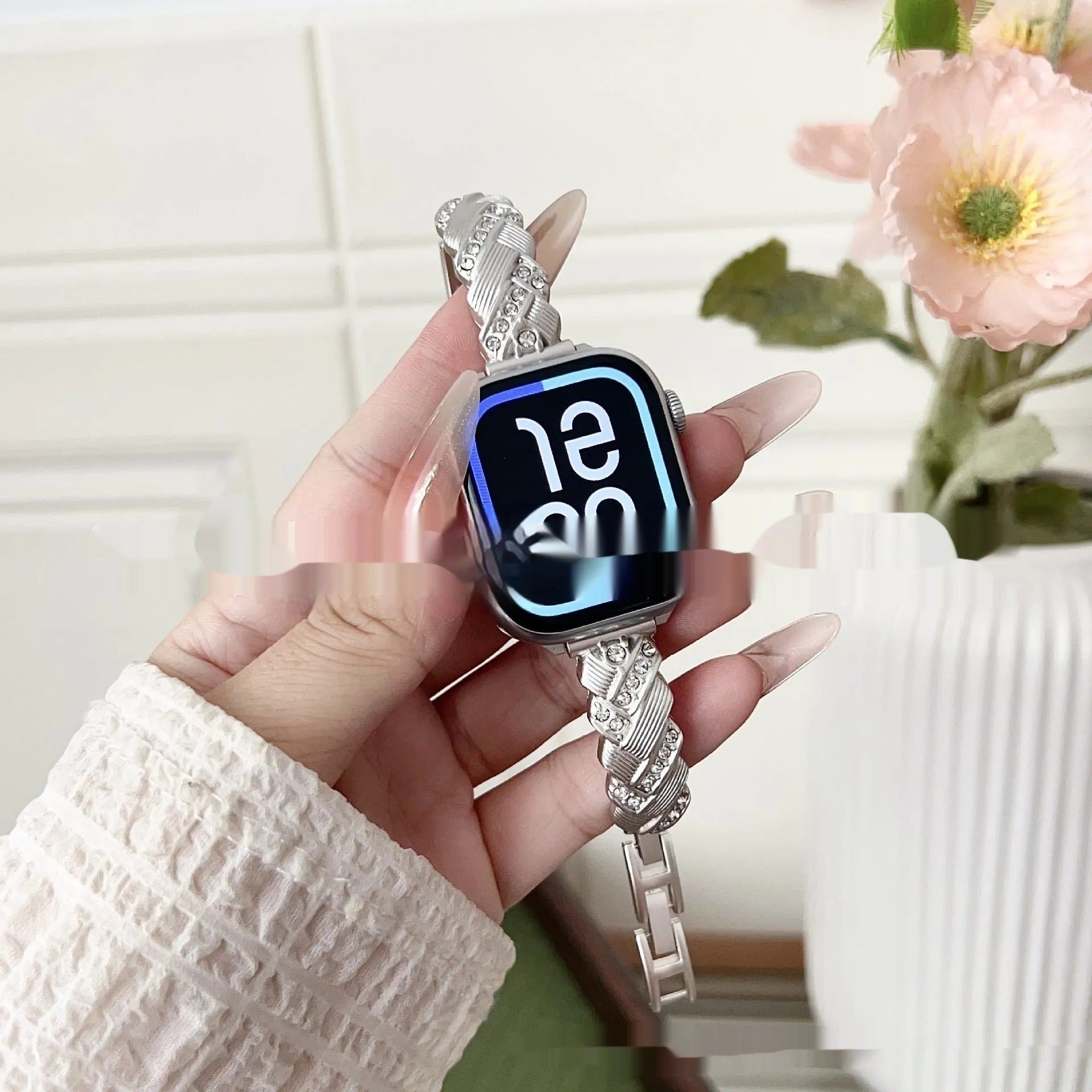 Zinc alloy twist design watch strap with diamond accents for Apple Watch, shown in silver colour.