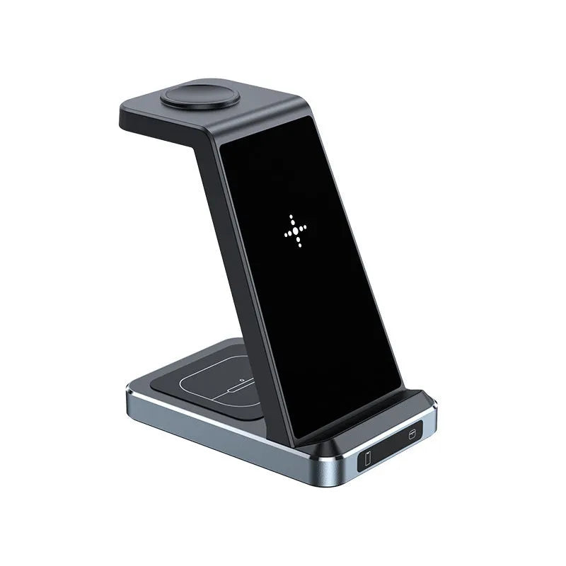 X2 three-in-one wireless charger in black charging a phone, watch, and earbuds on a desk