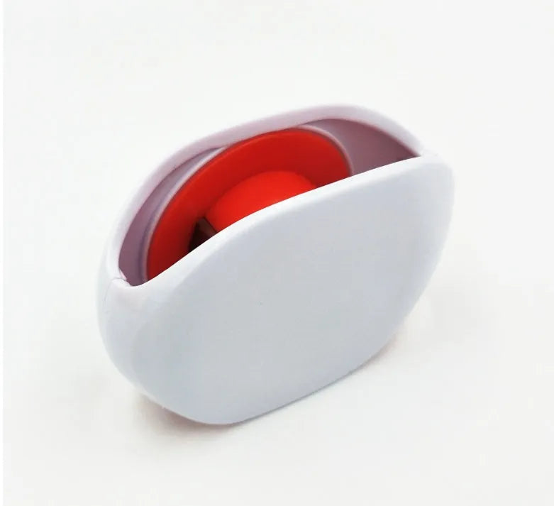 Compact automatic earphone winder in multiple colours on a grey background, showing extended cable.