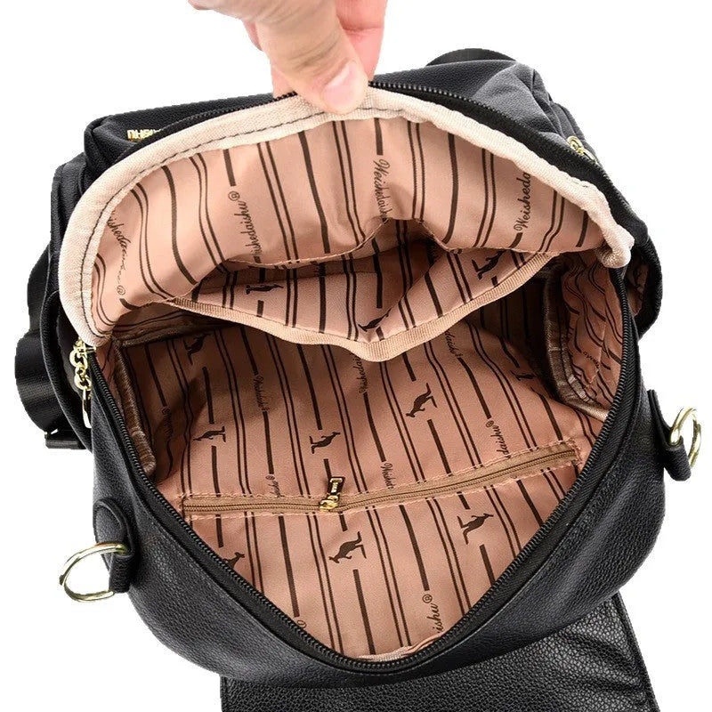 Genuine leather travel backpack with pendant in beige colour for female students, featuring belt decoration and splicing details