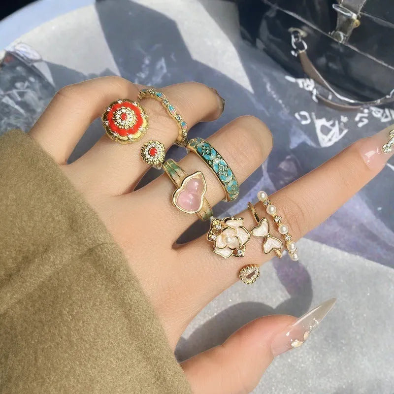 Close-up of a vintage-style adjustable copper ring with a gourd and floral design in a zircon inlaid finish.
