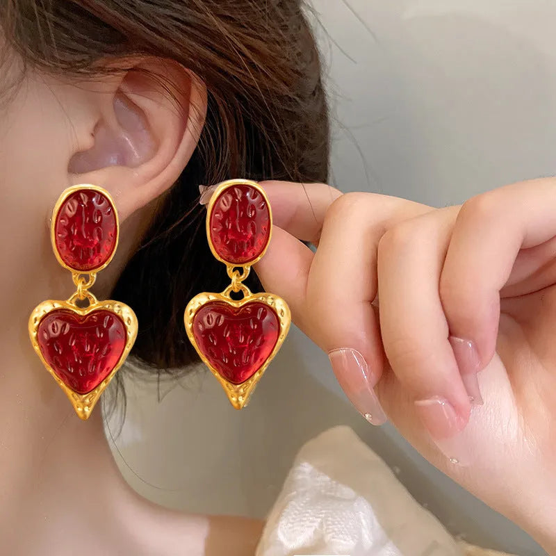 Oval love heart stud earrings with pleated texture in purple, red, green, and yellow-white colour options