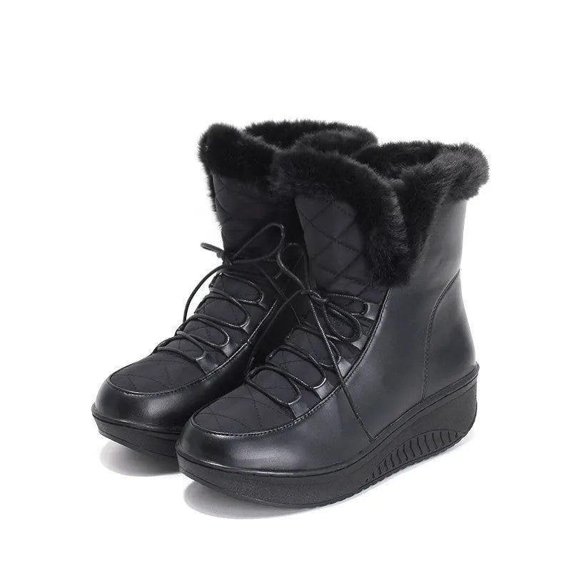 Women's black lace-up winter boots with a platform sole on a white background