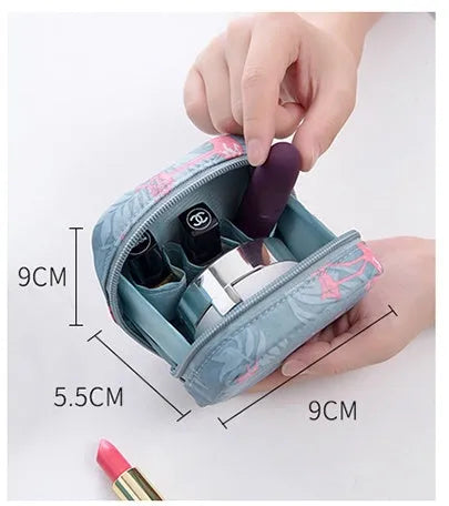 Blue cloth cube-shaped makeup storage bag with a plain pattern on a white background.