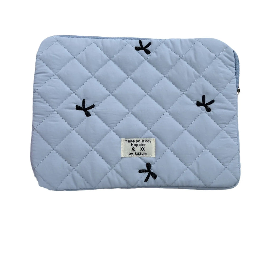 White nylon laptop bag with a light blue embroidered rhombus bow on the front