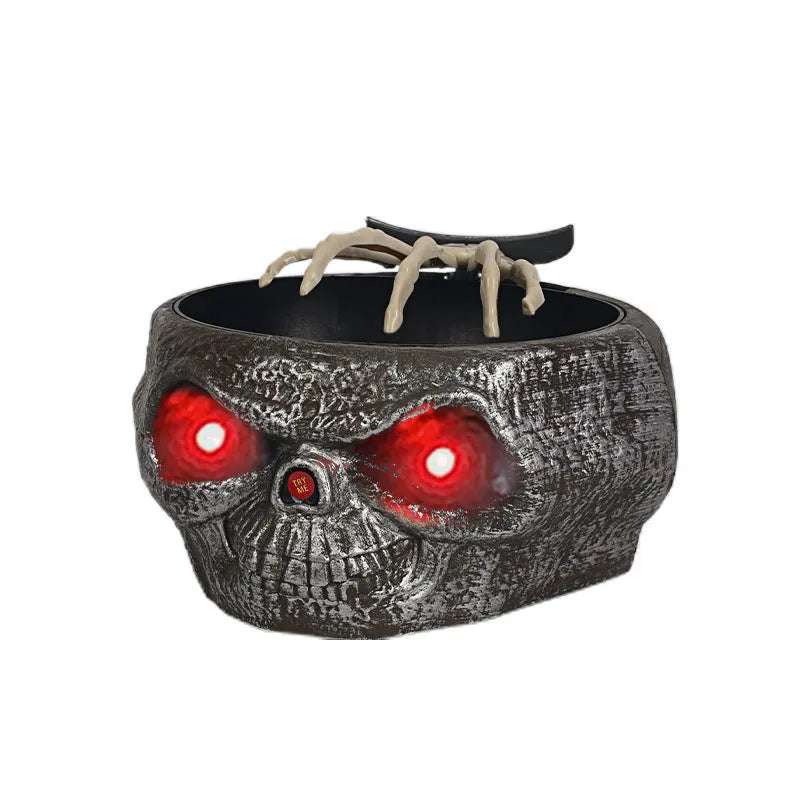 Plastic Halloween pumpkin candy bowl with motion-activated skeleton hand and lighted red eyes