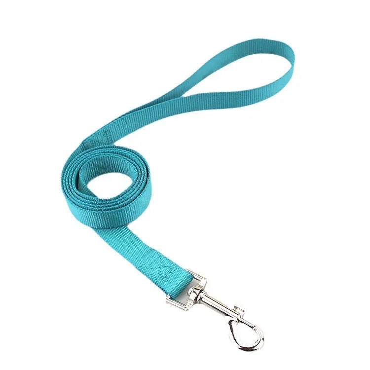 Solid colour nylon dog hand holding rope and tug toy in various colours and sizes.