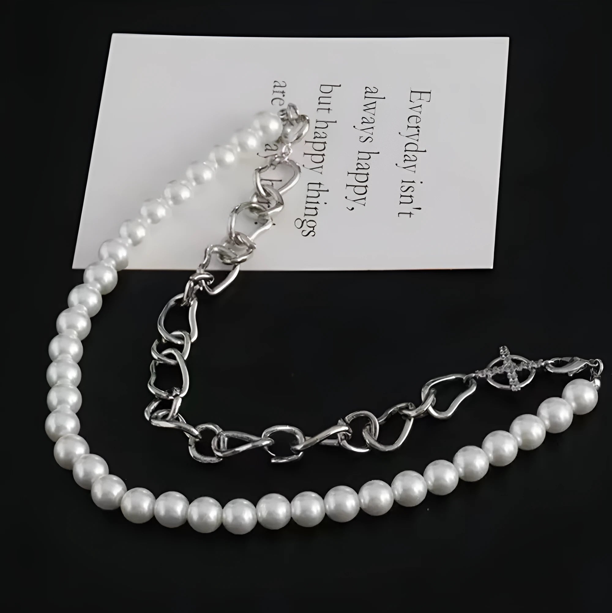White acrylic geometric pendant necklace with asymmetric design on twisted chain, clavicle length