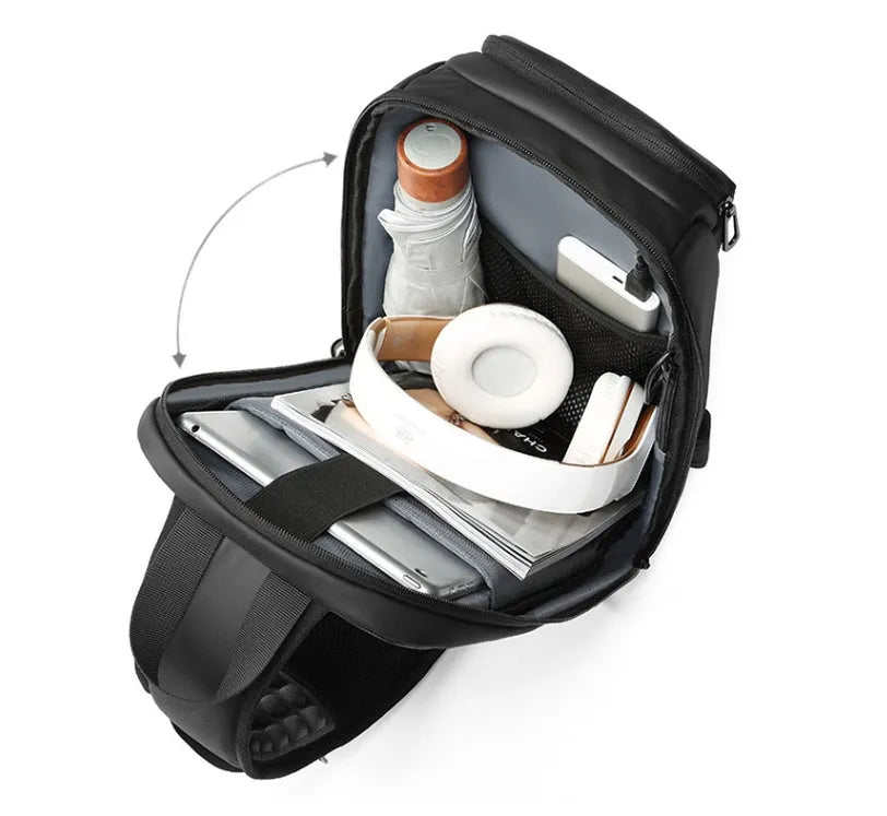 Black square PVC outdoor shoulder bag with an air cushion strap and zipper opening.