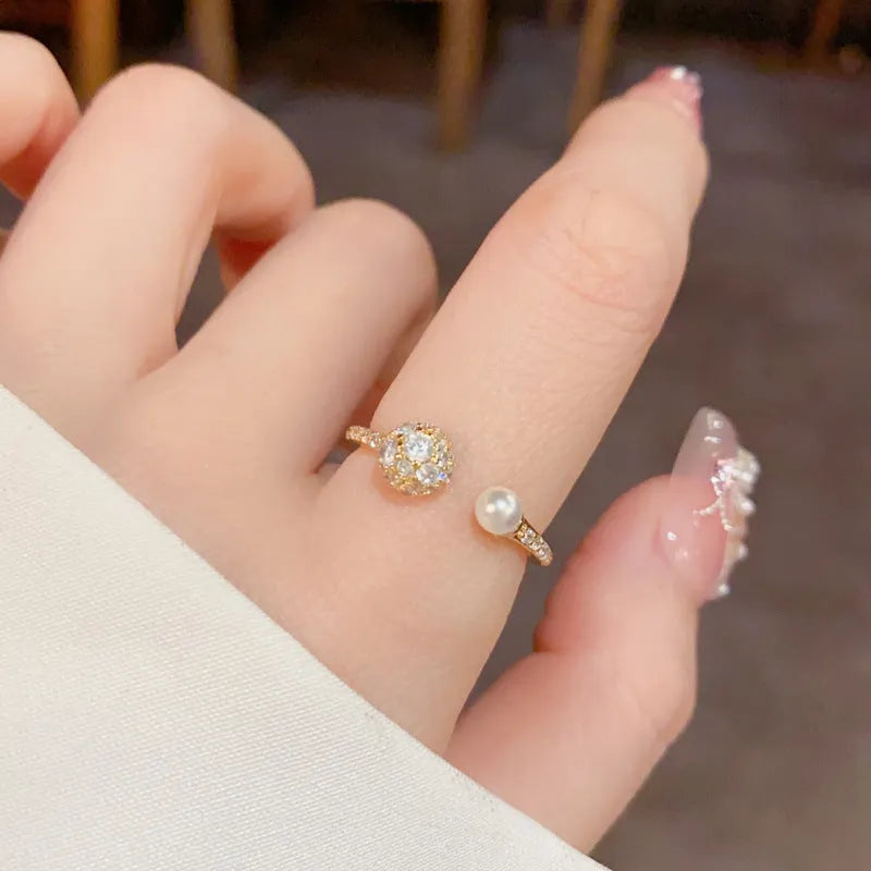 Round zircon open-end ring with gold plating on copper in gold or silver colour