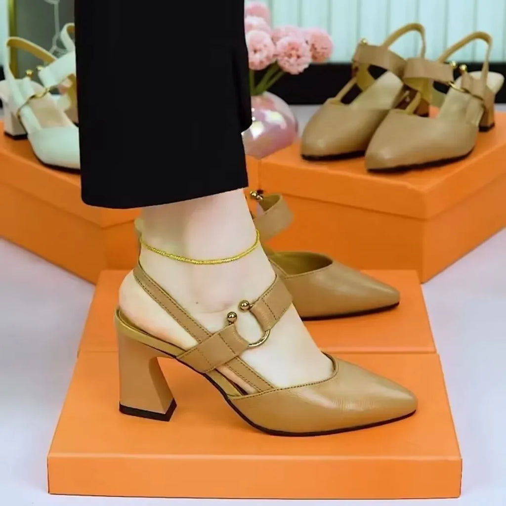 Women's apricot coloured leather closed toe sandals with a chunky heel on a white background.
