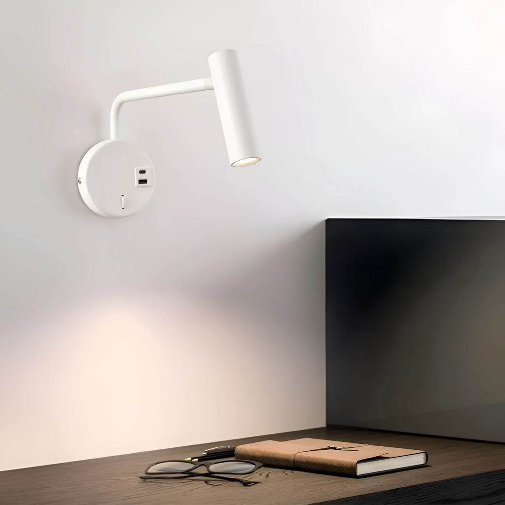 Black minimalist rocker reading wall lamp with LED light on a white wall