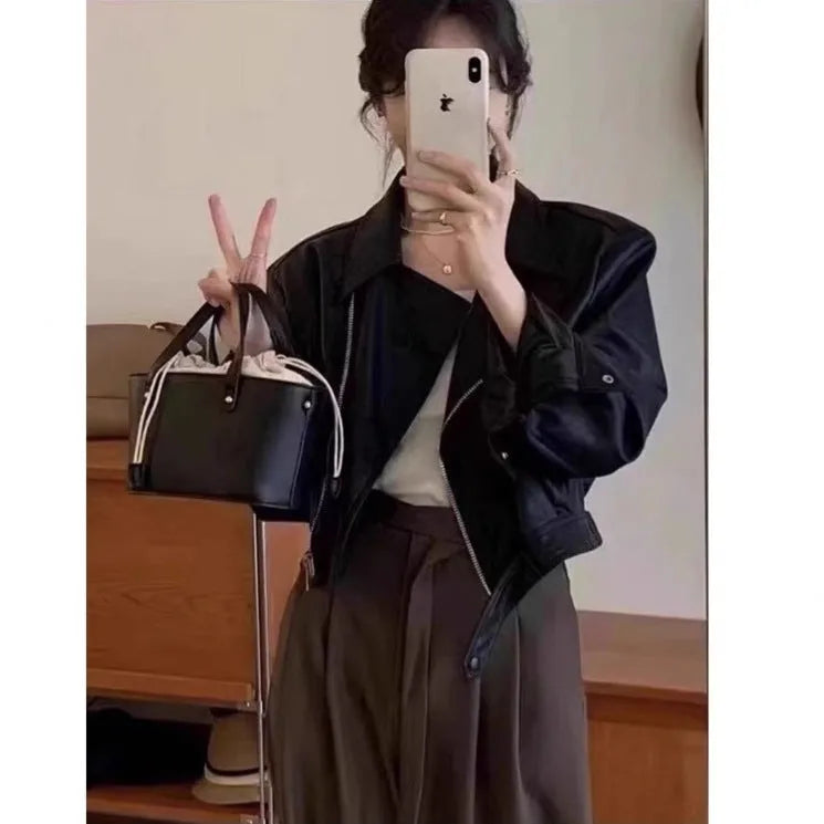 Brown women's retro slim fit leather-look jacket with pockets, short 40cm length.