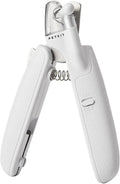 White pet nail clippers with LED light and transparent guard, shown with a separate nail file on a table.