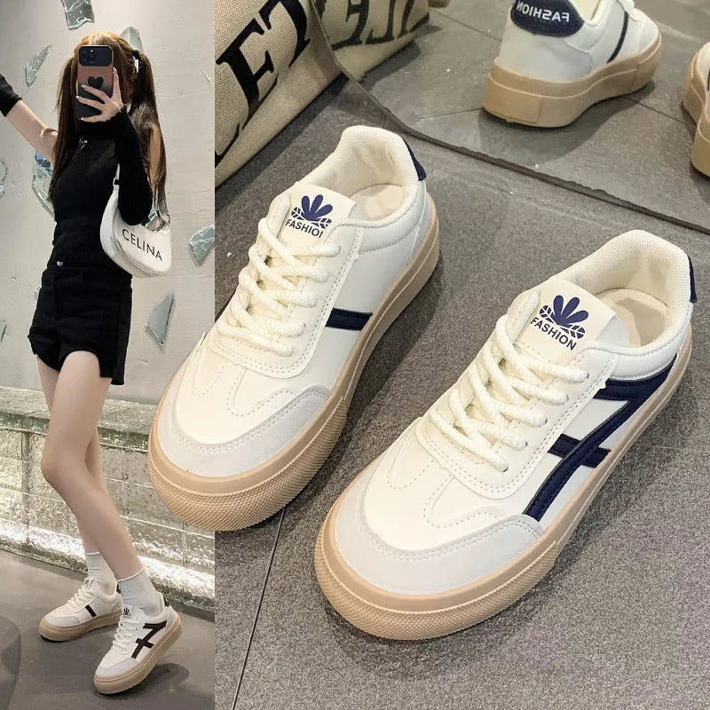 Brown and blue low-top casual lace-up shoes with a round toe and flat rubber sole.