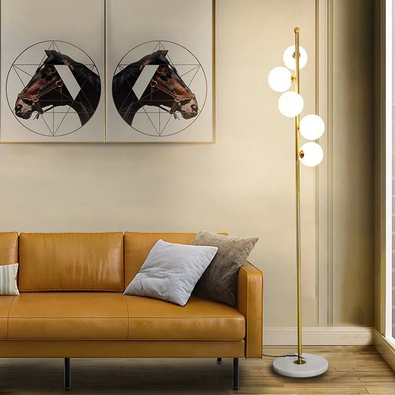 Simple iron floor lamp with 8W LED tricolour bulb in black ribbon gold finish