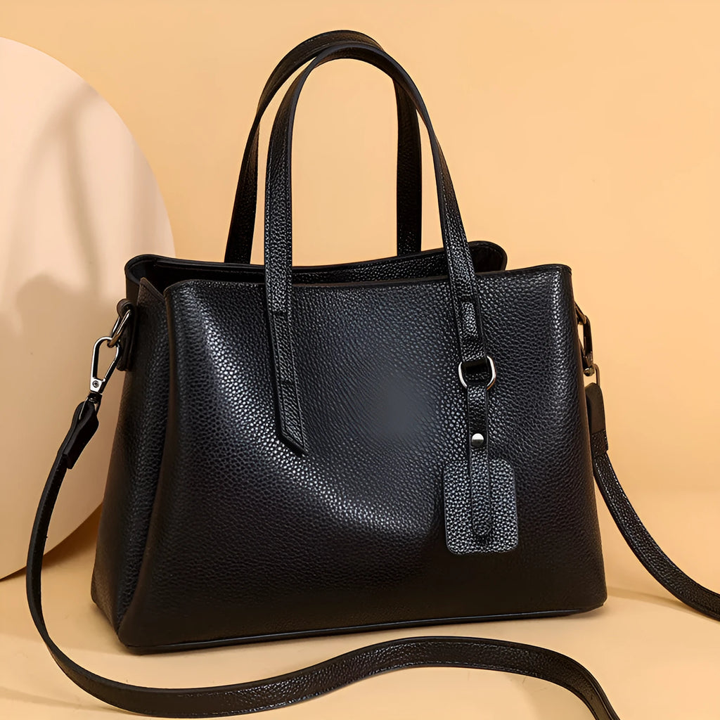 Genuine cowhide leather women's large capacity shoulder handbag in horizontal square shape with organiser pockets.