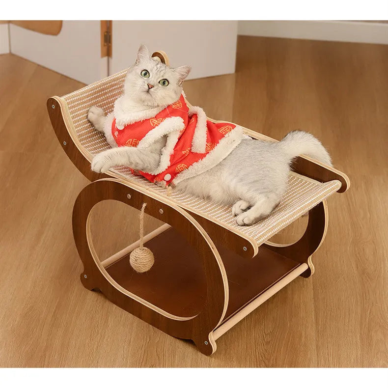 Solid wood frame cat bed with a light-coloured sisal scratching and lounging mat, shown on a wooden floor.