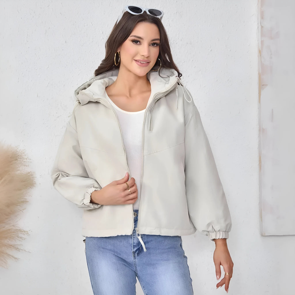 A woman's loose-fit hooded jacket in solid-colour polyester, shown in grey.