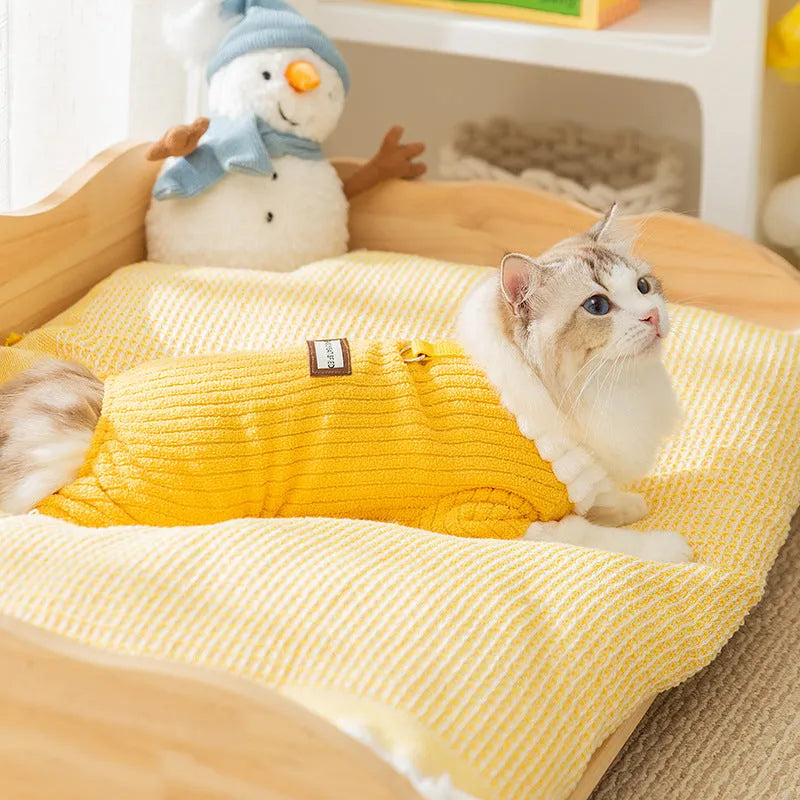 Yellow ribbed fleece pet jumpsuit with white ruffled cuffs and leash ring for cats and small dogs.