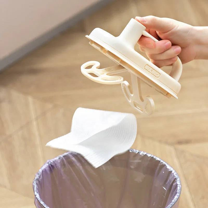 Magic Brush cleaning tool with plastic handle and stack of 50 white disposable non-woven fabric rags