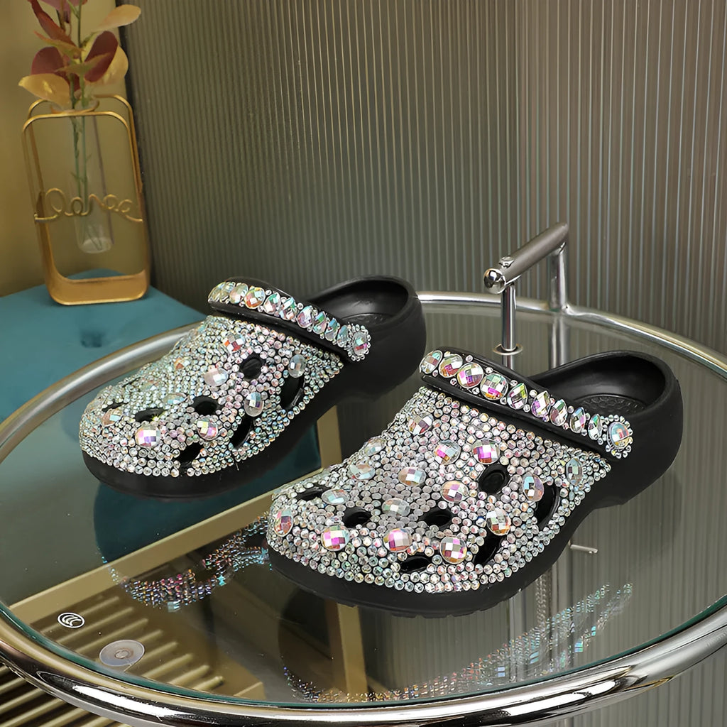 Black platform sandals with rhinestone decoration and hole design across EVA upper