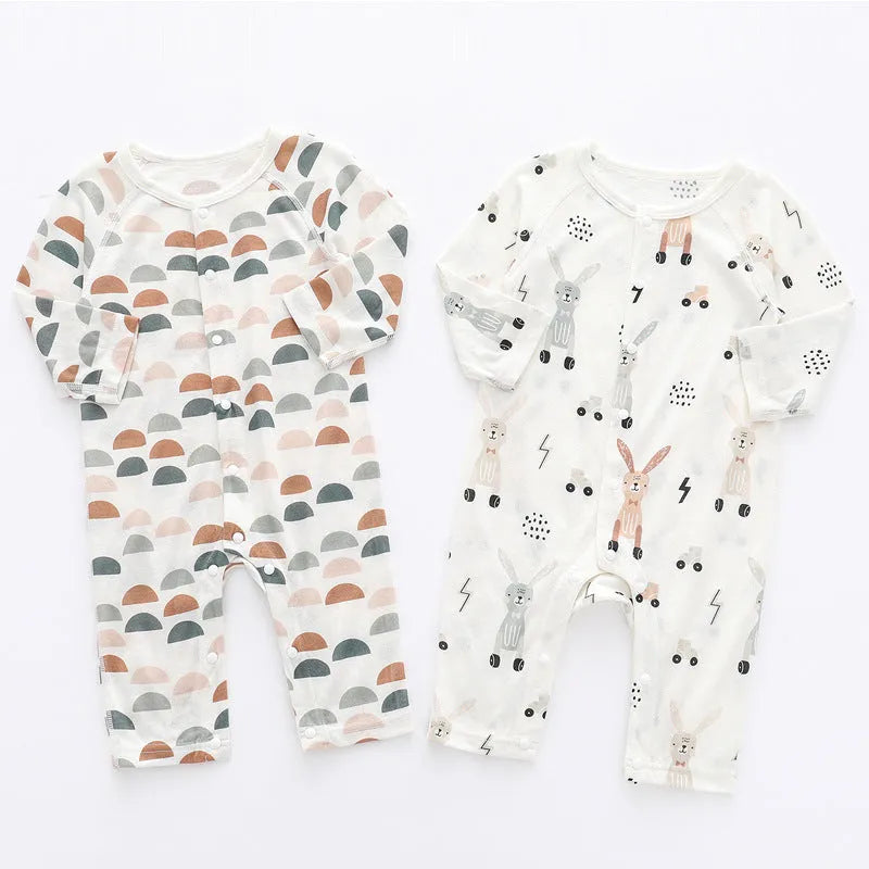 Baby wearing a soft bamboo fibre jumpsuit with a cute Nordic animal print, long sleeves.