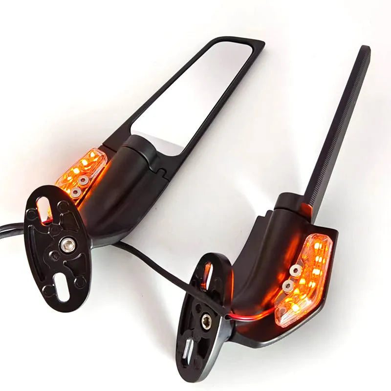 Pair of aluminium motorcycle mirror spoilers with yellow LED lights and convex glass lenses.